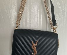 Black quilted flap shoulder bag with gold hardware