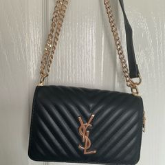 Black quilted flap shoulder bag with gold hardware