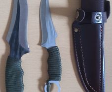 Two knives in a holster, for hunting, meat, tourism, camping.
