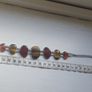A vintage bracelet featuring natural stone accents. Image 2