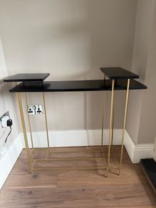 Brass and black console table
