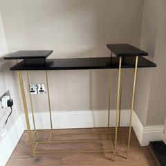 Brass and black console table
