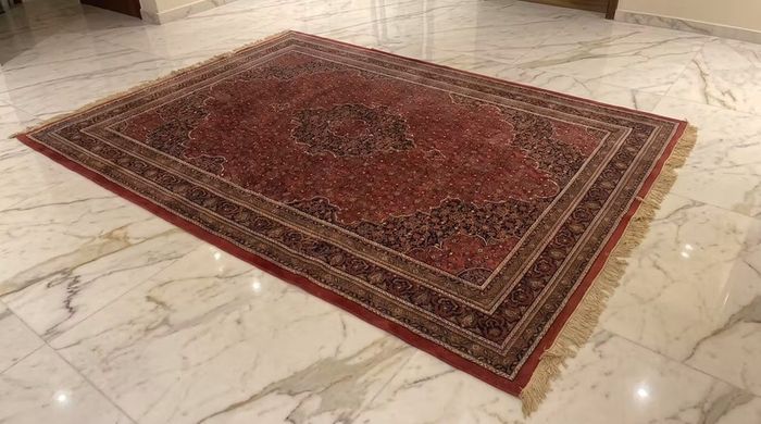 This is a good old hand knotted carpet with no wear