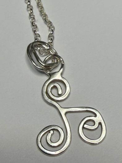 Sterling silver Triskele pendant on 18 or 20 inch chain.
