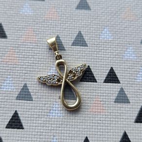 Gold pendant, stamped 375. A few stones are missing, so selling for repair. Please see photos for condition.