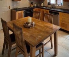 Solid oak table and four chairs