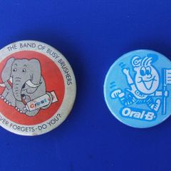 ORAL-B & CREST (dental care) - two promotional button badges (1970s / 1980s)