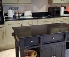 Black granite kitchen counter tops including sink and tap