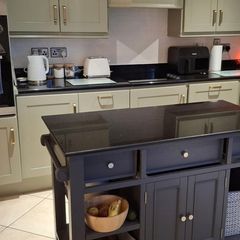 Black granite kitchen counter tops including sink and tap