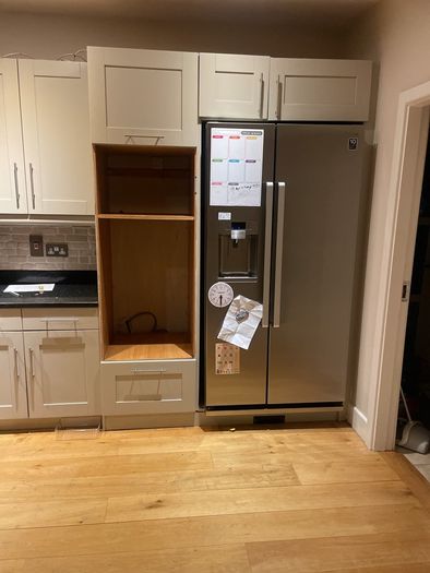 Entire kitchen Quartz work top solid wooden shaker style doors