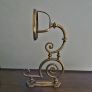 Victorian oil lamp on ornate brass sconce Image 3