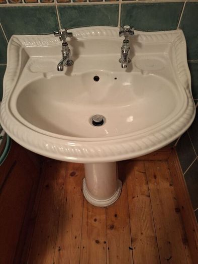 bathroom sink and pedestal