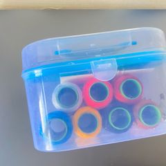 Compact Sewing Kit with Storage Case Includes multi-color thread spools, measuring tape, snips, buttons, and basic tools in a clear plastic organizer. Great condition, clean, and perfect for everyday household repairs or travel!