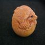 Carved wooden dragon hatching from an egg. Image 2