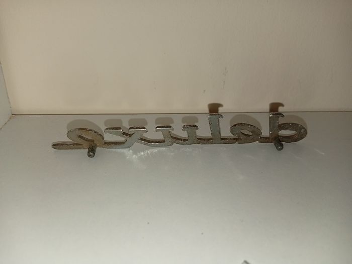 Classic Car " DELUXE " CAR BADGE, Good condition with 2 mounting pins vintage