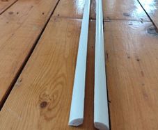 Two 2.4m lengths of white wooden moulding 10x10mm