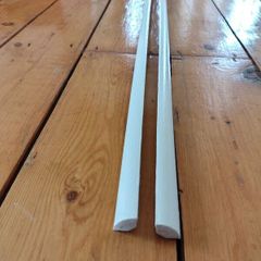 Two 2.4m lengths of white wooden moulding 10x10mm