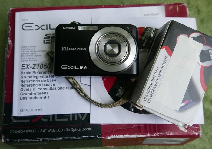 Casio Exilim EX-Z1050 Digital camera Made w/ Box and Accessories , universal charger- Tested