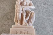 Vintage Moses sculpture on marble plinth.