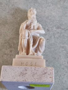 Vintage Moses sculpture on marble plinth.