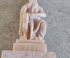 Vintage Moses sculpture on marble plinth.