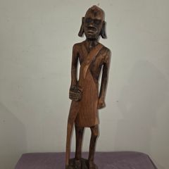 Tall carved wooden African Statue