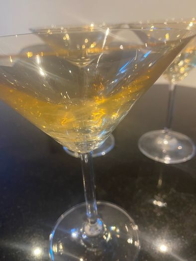 Set of four amber and plain glass martini or cocktail glasses