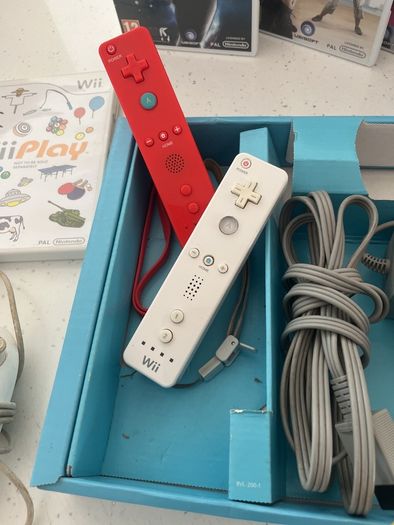 wii console , games and 2 controllers