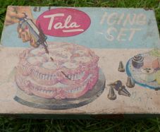 Vintage Tala icing tube with attachments c 1950s England preowned in the original box with instructions.