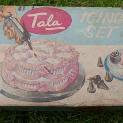 Vintage Tala icing tube with attachments c 1950s England preowned in the original box with instructions.
