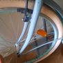 This is a B'TWIN Elops city bike, a fully-equipped urban commuter in a light blue color. Image 4
