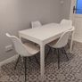 Extendable table and four chairs. Image 2