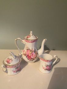Vintage Porcelain small teapot sugar bowl and creamer set .       porcelain