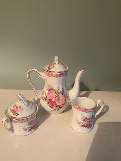 Vintage Porcelain small teapot sugar bowl and creamer set .       porcelain