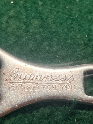 pair of vintage Guinness Bottle Openers
