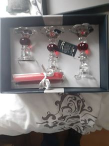 Newgrange candle holders new in box .20 euro .Would make a lovely christmas present .Glass with red and candles