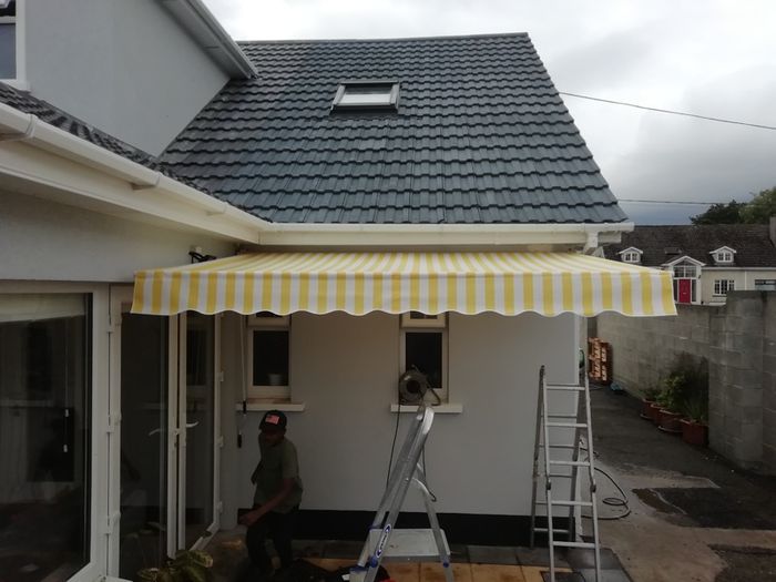 Awning 3x2m rain resistant yellow grey strips new in box .
