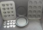 Bakeware/Chicago Metallic 12 Hole Mini Muffin Tin with Loose Bases/Cupcake Tray/Two Sponge Cake Trays/Cooling Rack .. Price is Now 33.00euro all 5 pieces