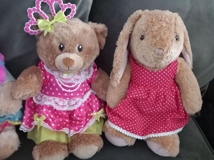 Build a Bear x 4 with outfits on.