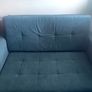 Grey fabric sofa bed with large storage compartment. Image 2