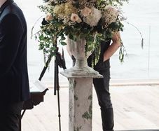 Wedding pedestal with flower arrangement