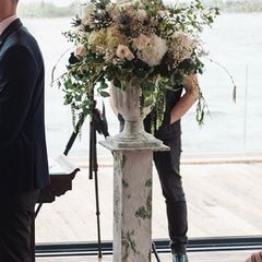 Wedding pedestal with flower arrangement