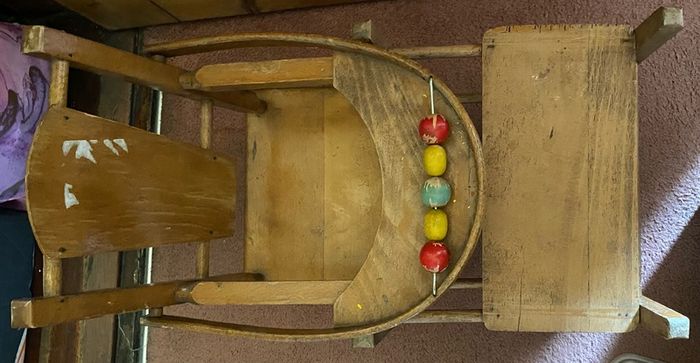 Vintage wooden doll high chair FROM THE 1930S featuring a built-in play tray with a wire bead