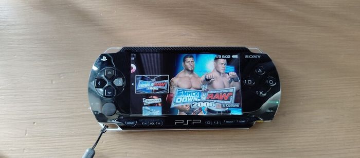 Psp 1000 Modded 64 GB 40 psp games Original battery charger cable