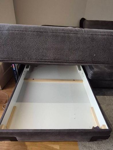 dark grey corner sofa with sleeping and storage