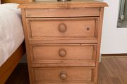 Solid antique pine three-drawer bedside locker