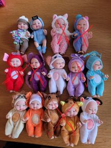 Mini baby dolls in sweet outfits