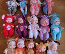 Mini baby dolls in sweet outfits
