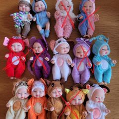 Mini baby dolls in sweet outfits