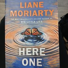 here one moment by liane moriarty author of big little lies. bestsellering fiction.